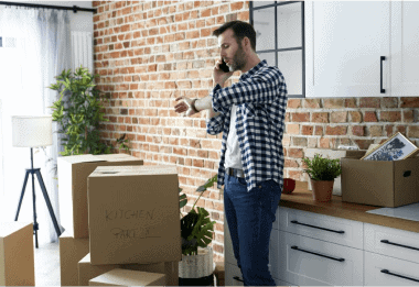 displeased man calling for help with moving house